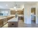 Kitchen featuring a long island, modern appliances, and a view of the laundry room at 7438 E Visao Dr, Scottsdale, AZ 85266