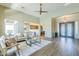 Open-concept living room with seamless flow to dining area and decorative furnishings at 7438 E Visao Dr, Scottsdale, AZ 85266