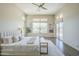Spacious and bright, this main bedroom features wood-look tile flooring and a beautiful ceiling fan at 7438 E Visao Dr, Scottsdale, AZ 85266