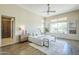 Bright main bedroom with lots of natural light, neutral decor and wood look tile floors at 7438 E Visao Dr, Scottsdale, AZ 85266