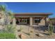 Covered patio provides outdoor living space and has access to the home's interior with desert surroundings at 7438 E Visao Dr, Scottsdale, AZ 85266