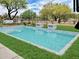 Stunning pool with lush landscaping and waterfall features, creating a serene outdoor oasis at 7438 E Visao Dr, Scottsdale, AZ 85266