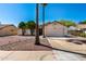 Charming single-Gathering home featuring desert landscaping, palm trees and a two-car garage at 8157 W Mclellan Rd, Glendale, AZ 85303