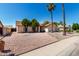 Charming single-Gathering home featuring desert landscaping, shade trees and a two-car garage at 8157 W Mclellan Rd, Glendale, AZ 85303