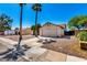 Charming single-Gathering home featuring desert landscaping, and a two-car garage at 8157 W Mclellan Rd, Glendale, AZ 85303