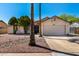 Charming single-Gathering home featuring desert landscaping, palm trees and a two-car garage at 8157 W Mclellan Rd, Glendale, AZ 85303