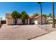 Charming single-Gathering home featuring desert landscaping, shade trees and a two-car garage at 8157 W Mclellan Rd, Glendale, AZ 85303