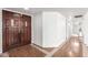 Welcoming foyer with double doors, beautiful hardwood floors, and neutral wall color at 8157 W Mclellan Rd, Glendale, AZ 85303