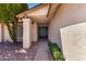 Inviting front entrance with a beautiful front door, desert landscaping, and tiled walkway at 8157 W Mclellan Rd, Glendale, AZ 85303