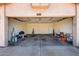Spacious two car garage with overhead lighting, and door to backyard at 8157 W Mclellan Rd, Glendale, AZ 85303