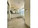 A well-lit bathroom with a double vanity, granite countertop, and tile floor at 9001 W Windsor Ave, Phoenix, AZ 85037