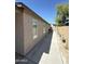 Exterior side view showing stucco and side yard access at 9001 W Windsor Ave, Phoenix, AZ 85037
