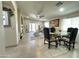 Inviting living room with tile flooring, ample natural light, and a dining area, perfect for gatherings and relaxation at 9001 W Windsor Ave, Phoenix, AZ 85037