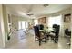 Inviting living room with tile flooring, ample natural light, and a dining area, perfect for gatherings and relaxation at 9001 W Windsor Ave, Phoenix, AZ 85037