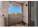 This balcony overlooks neighborhood streets and features an arched roof at 9151 W Greenway Rd # 212, Peoria, AZ 85381