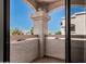 Balcony with an arch support showcasing the buildings exterior at 9151 W Greenway Rd # 212, Peoria, AZ 85381