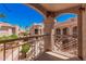 Inviting condo balcony view showcases lush landscaping and charming architecture at 9151 W Greenway Rd # 212, Peoria, AZ 85381