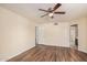 A bedroom featuring wood floors, a ceiling fan, and doorways into other rooms at 9151 W Greenway Rd # 212, Peoria, AZ 85381