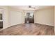 Spacious bedroom featuring wood floors, a ceiling fan, closet, and sliding glass doors at 9151 W Greenway Rd # 212, Peoria, AZ 85381