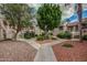 Condo courtyard showcasing mature trees, walkways, and lush landscaping at 9151 W Greenway Rd # 212, Peoria, AZ 85381