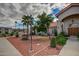 Beautiful condo exterior with desert landscaping, trees, and a sidewalk at 9151 W Greenway Rd # 212, Peoria, AZ 85381