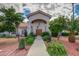 Inviting home entrance with lush landscaping, desert plants and walkway at 9151 W Greenway Rd # 212, Peoria, AZ 85381