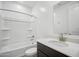 Bathroom featuring a single sink vanity, a large mirror, and a shower-tub combination at 9533 W Luxton Ln, Tolleson, AZ 85353