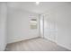 Neutral bedroom featuring carpet, a window, and a double door closet at 9533 W Luxton Ln, Tolleson, AZ 85353
