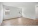 Spacious living room boasting wood-look tile flooring and great natural light at 9533 W Luxton Ln, Tolleson, AZ 85353