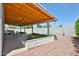 This beautiful backyard patio boasts a wood slat ceiling and landscaping with blooming flowers at 9851 N 28Th Way, Phoenix, AZ 85028