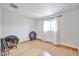 Bedroom with hardwood floors, a window, and neutral tones for a calming atmosphere at 9851 N 28Th Way, Phoenix, AZ 85028