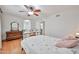 Bedroom featuring hardwood floors, a bed, and natural lighting at 9851 N 28Th Way, Phoenix, AZ 85028