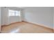 Bright and simple bedroom featuring hardwood floors and a window for natural light at 9851 N 28Th Way, Phoenix, AZ 85028