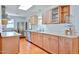 Well-lit kitchen featuring wooden cabinets, stainless steel appliances, and ample counter space at 9851 N 28Th Way, Phoenix, AZ 85028