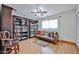 Inviting living room features beautiful hardwood floors, bookshelves, and a cozy seating area at 9851 N 28Th Way, Phoenix, AZ 85028