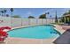 Backyard pool featuring clear blue water, desert landscaping, and privacy fence at 9851 N 28Th Way, Phoenix, AZ 85028