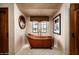 Spa-like bathroom featuring a freestanding copper bathtub, elegant fixtures, and decorative artwork at 1015 W Encanto Blvd, Phoenix, AZ 85007