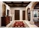 Elegant foyer features a decorative rug, a dark wood chest, and an arched doorway at 1015 W Encanto Blvd, Phoenix, AZ 85007
