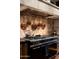 Gourmet kitchen with professional-grade range, custom hood, copper cookware, and decorative tile backsplash at 1015 W Encanto Blvd, Phoenix, AZ 85007