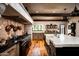 Gourmet kitchen showcases professional appliances, a stone backsplash, and custom cabinetry at 1015 W Encanto Blvd, Phoenix, AZ 85007