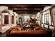 Elegant living room boasts hardwood floors, beamed ceilings, and luxurious leather furniture at 1015 W Encanto Blvd, Phoenix, AZ 85007