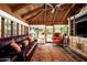 Cozy sunroom features wood paneled ceiling, large windows, and comfortable seating at 1015 W Encanto Blvd, Phoenix, AZ 85007