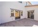 Back patio featuring pavers, sliding glass doors to the home, and a block wall for added privacy at 10324 W Sands Dr # 476, Peoria, AZ 85383