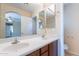 Bathroom featuring a double vanity sink with a large mirror, and a toilet at 10324 W Sands Dr # 476, Peoria, AZ 85383