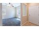 View of the bedroom with neutral walls and carpet, visible from the doorway with an entryway door to the right at 10324 W Sands Dr # 476, Peoria, AZ 85383