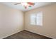 Empty bedroom featuring neutral walls, carpeting, and a ceiling fan with natural light at 10324 W Sands Dr # 476, Peoria, AZ 85383