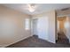 Bedroom with neutral walls, carpeted flooring, a closet, and natural light at 10324 W Sands Dr # 476, Peoria, AZ 85383