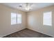 Bright bedroom with two windows providing natural light and carpeted floors at 10324 W Sands Dr # 476, Peoria, AZ 85383