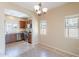 Cozy eat-in kitchen with stainless appliances, warm wood cabinets, and tile flooring at 10324 W Sands Dr # 476, Peoria, AZ 85383