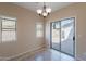 Sunny eat-in kitchen featuring tile flooring, neutral walls, and backyard views at 10324 W Sands Dr # 476, Peoria, AZ 85383